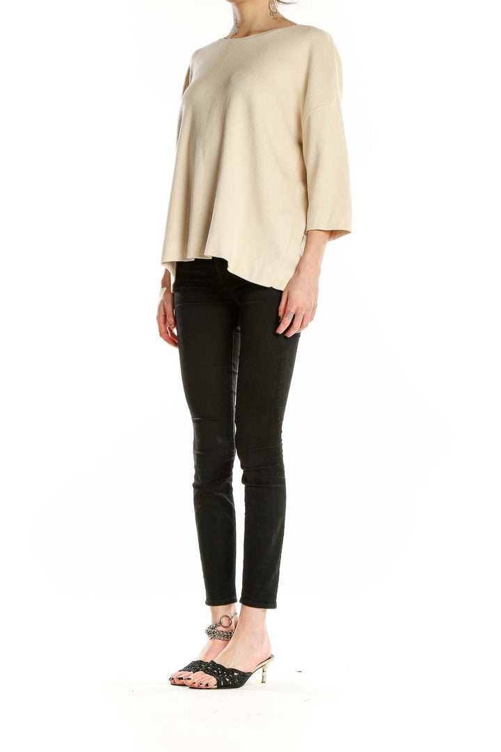 Front view of cream J.Jill relaxed fit knit sweater with 3/4 sleeves