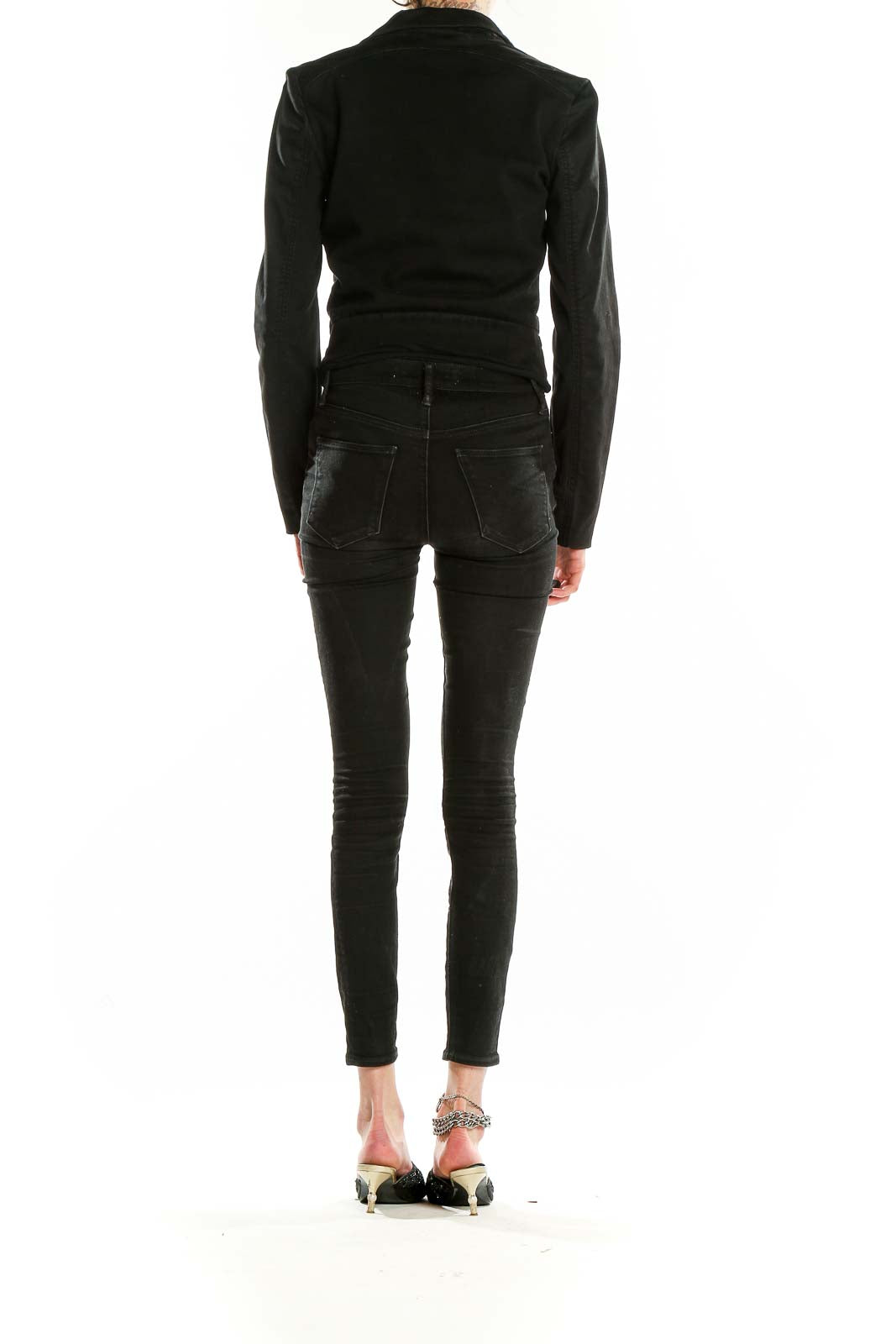 Back view of Armani Exchange black cropped jacket on model with skinny jeans