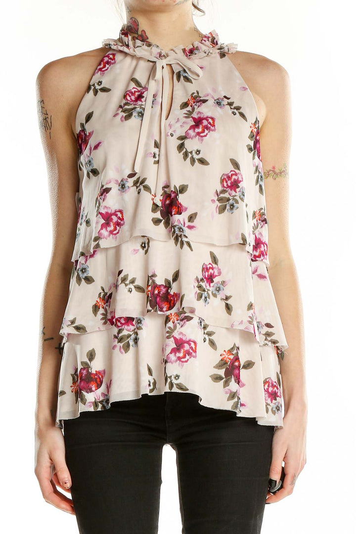 Front view of beige floral tiered sleeveless top from White House Black Market