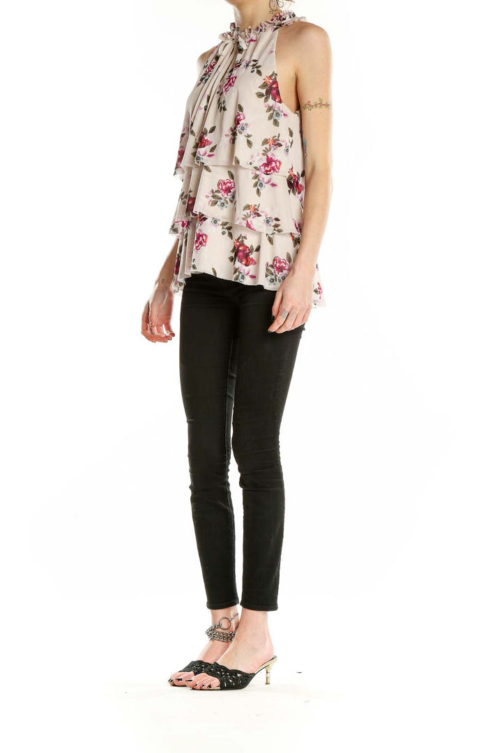 Front view of beige floral tiered sleeveless top from White House Black Market