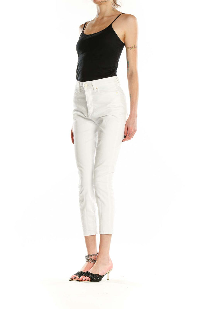 Front view of Ann Taylor Petites white cropped jeans on model