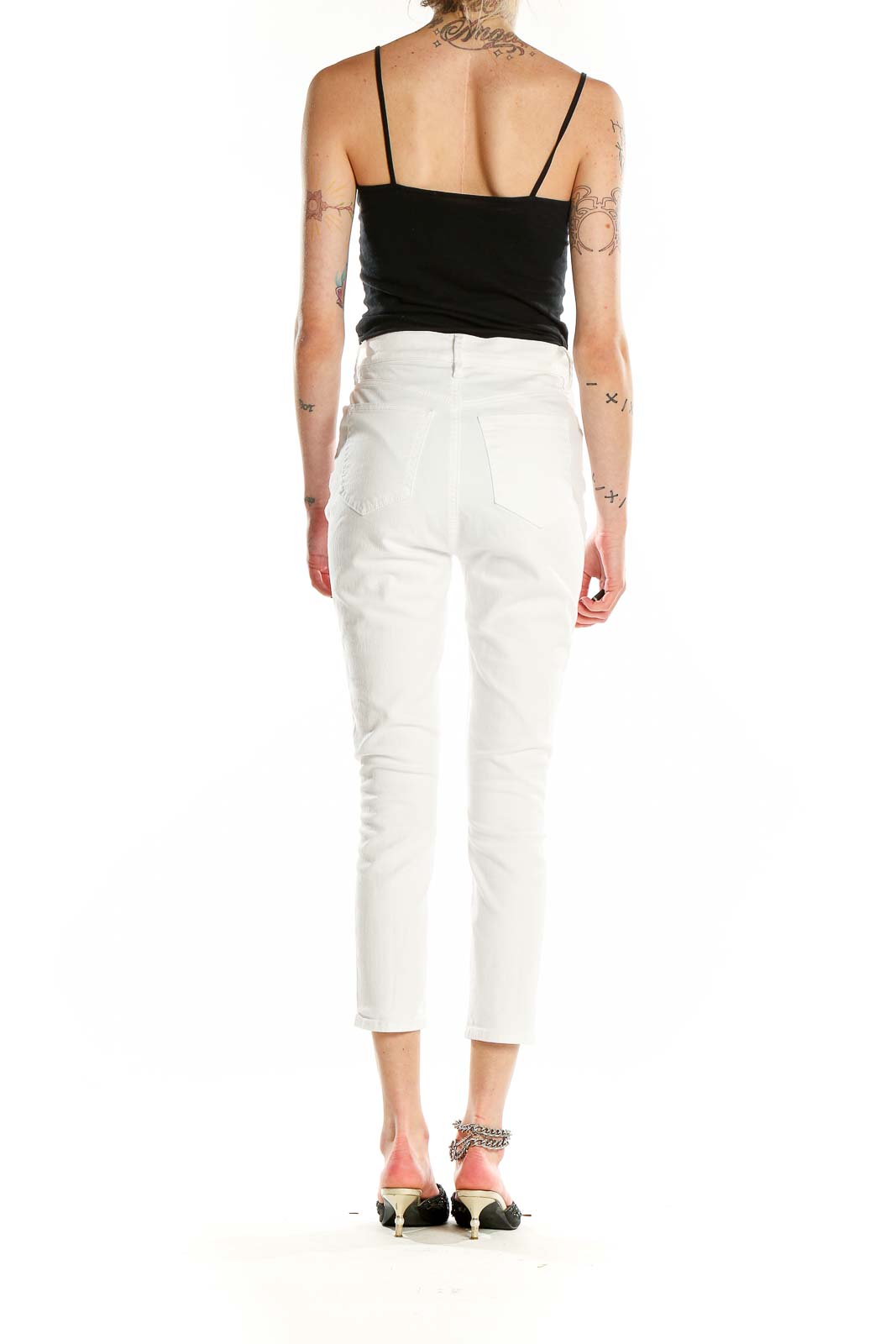 Back view of Ann Taylor Petites white cropped jeans on model