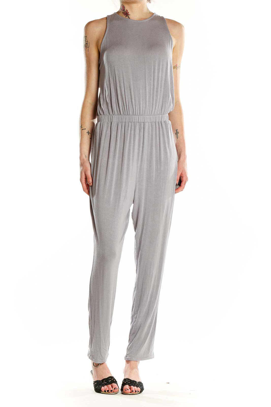 Front view of gray sleeveless jumpsuit with high neckline