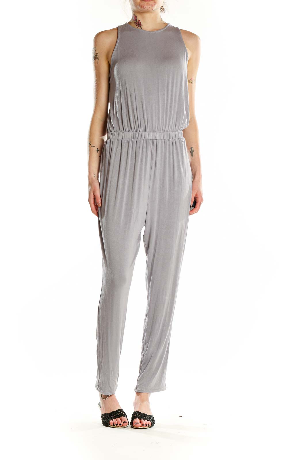 Front view of gray sleeveless jumpsuit with high neckline