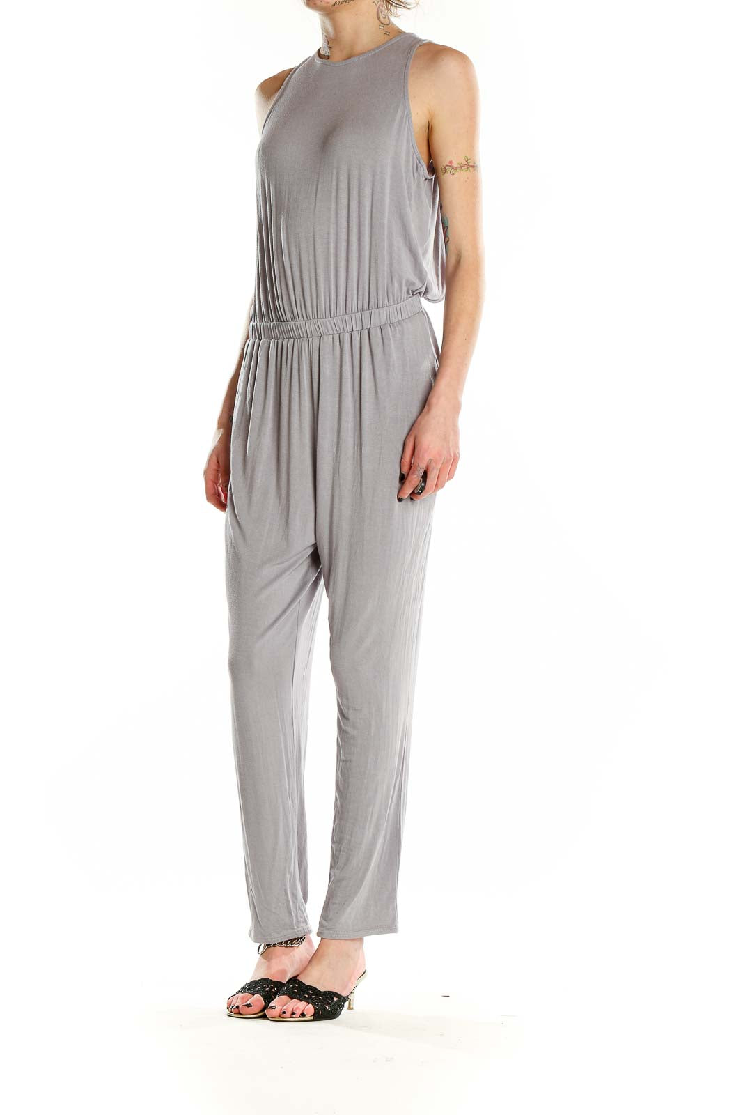 Front view of gray sleeveless jumpsuit with high neckline