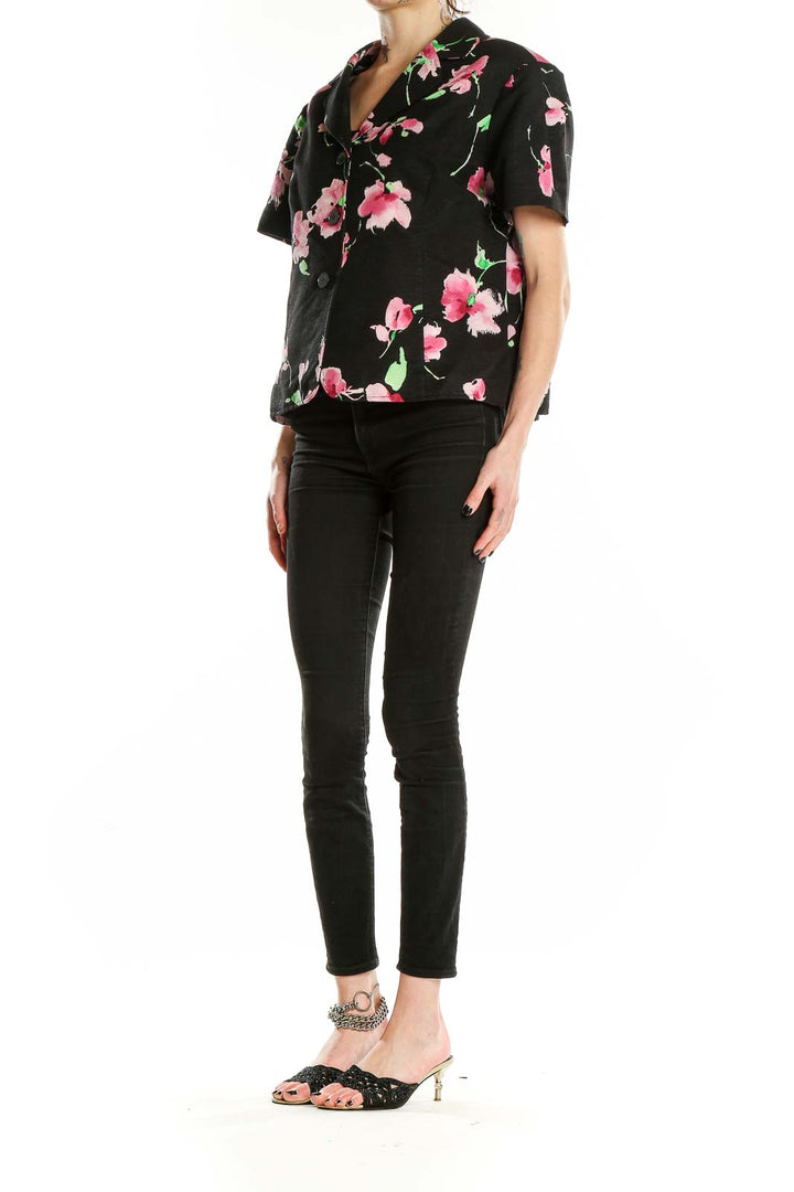 Front view of St. John black jacket with pink floral print, short sleeves