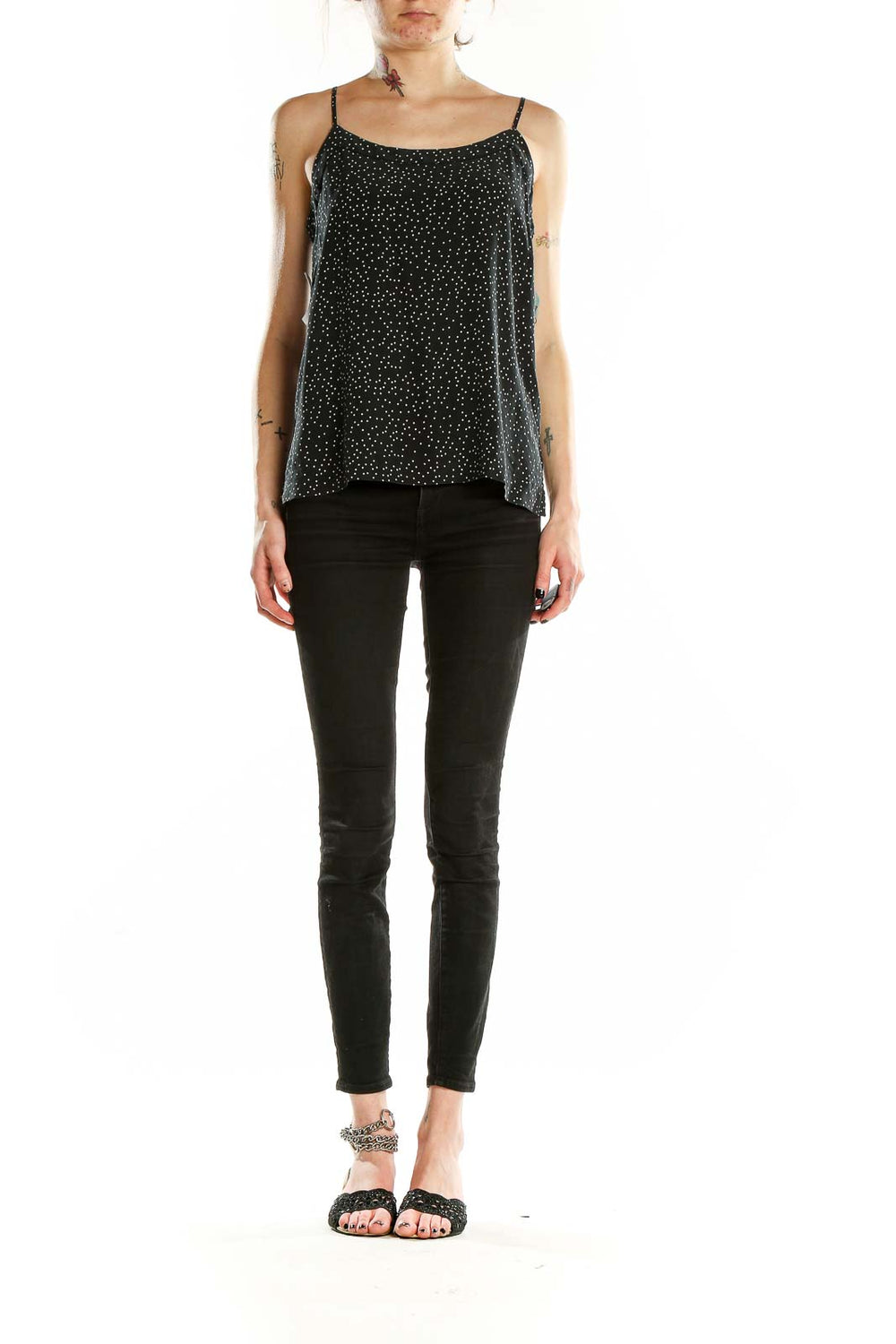 Front view of Madewell black silk camisole with white polka dots