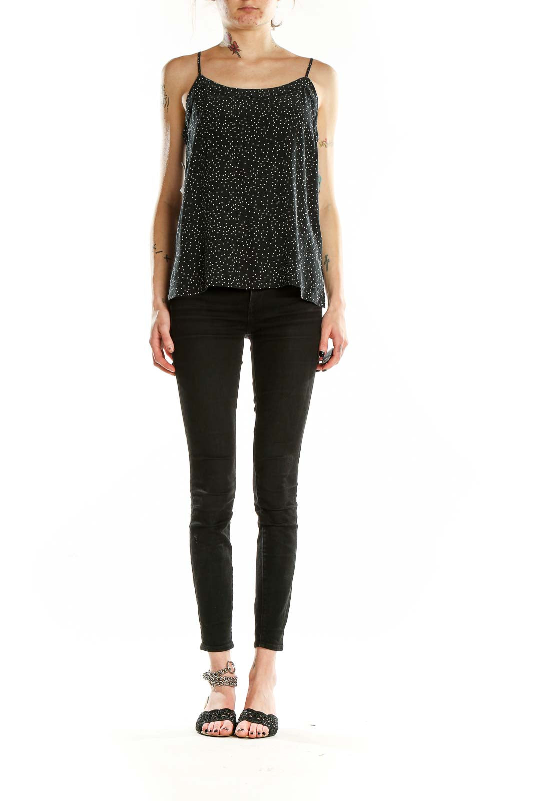 Front view of Madewell black silk camisole with white polka dots