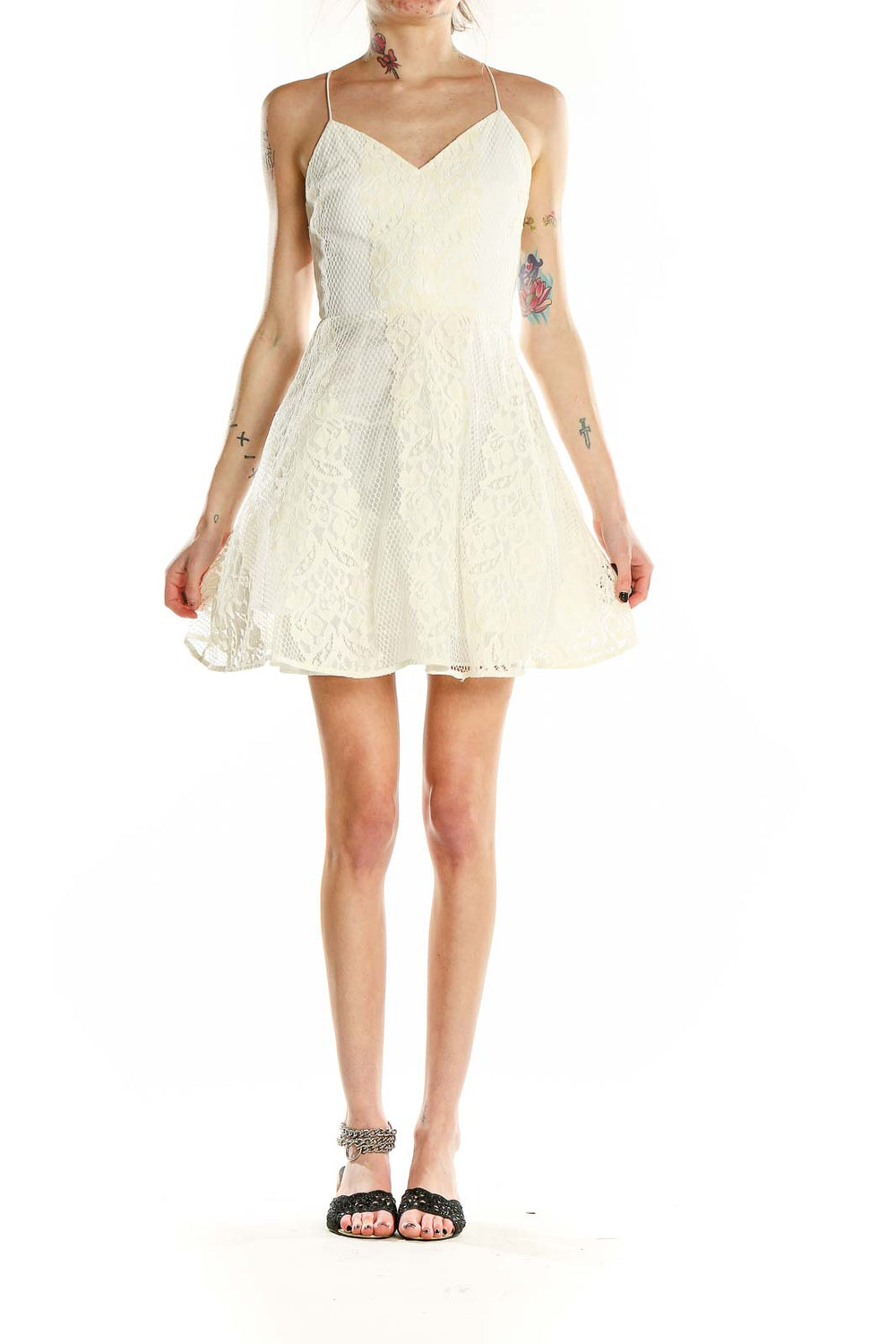 Front view of Soloiste white lace fit-and-flare mini dress with spaghetti straps