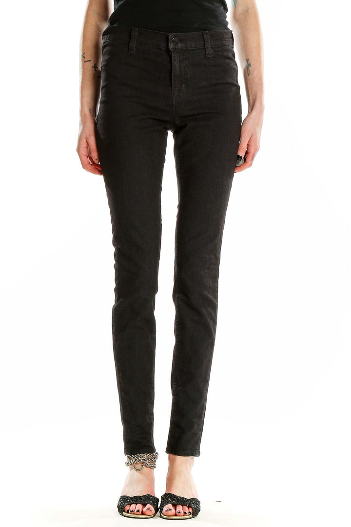 Front view of J Brand black skinny high-rise jeans on model