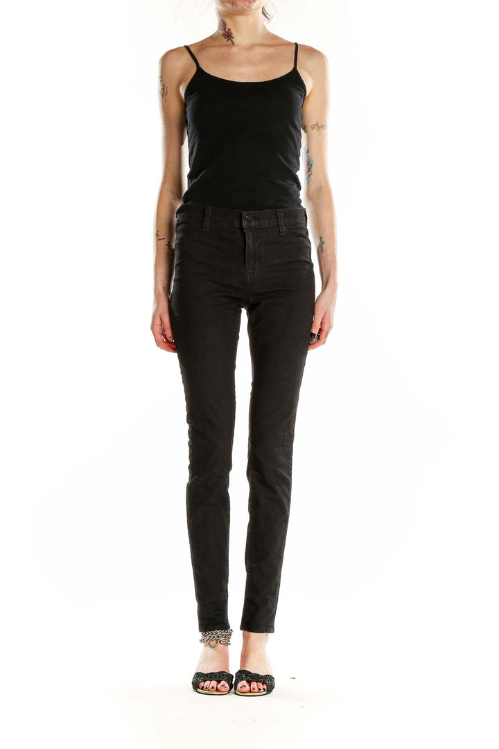 Front view of J Brand black skinny high-rise jeans on model