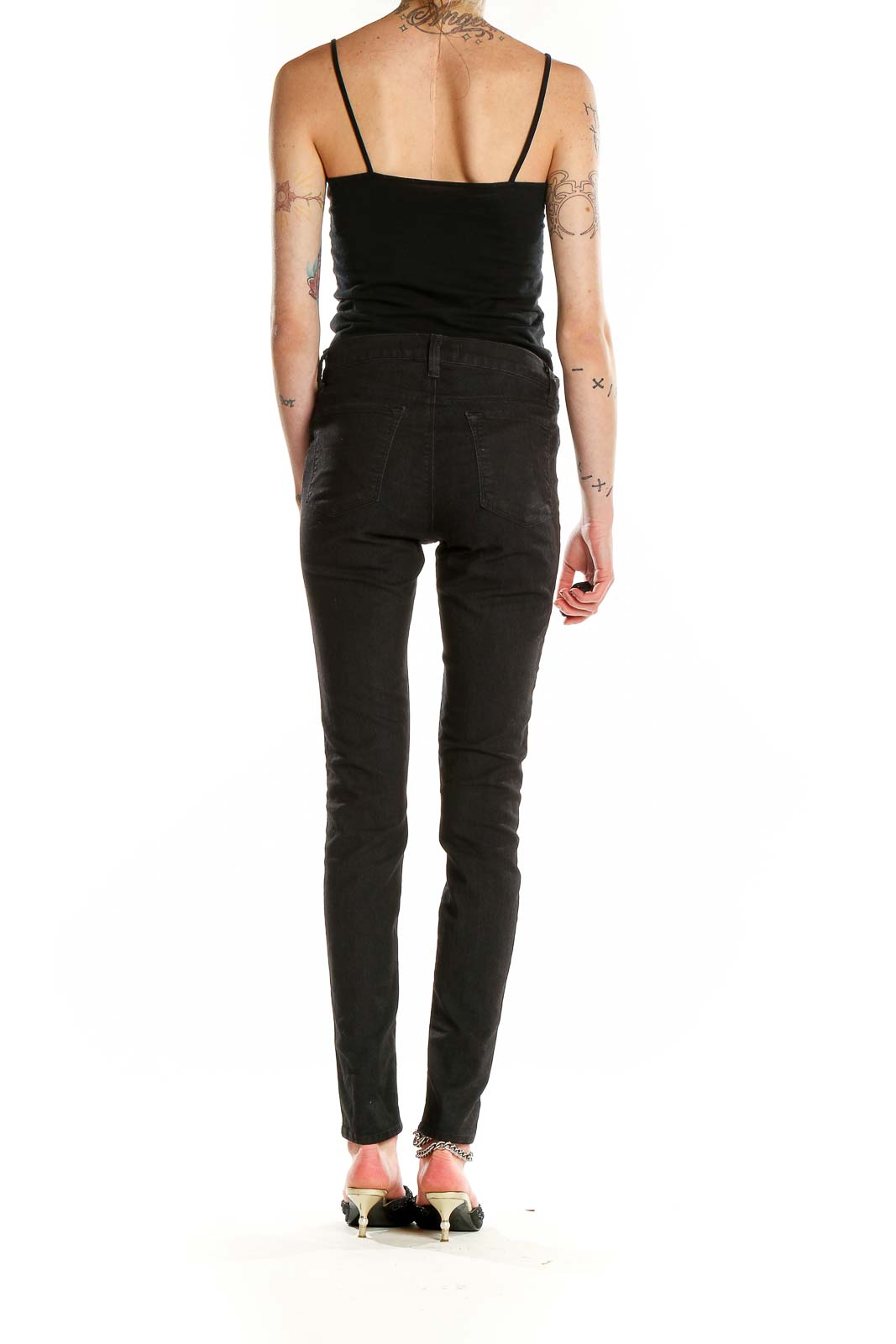 Back view of J Brand black skinny high-rise jeans on model