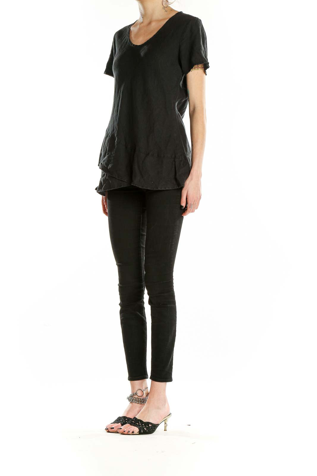 Front view of black linen short-sleeve top with layered hem by FLAX