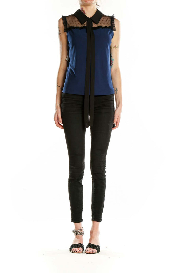 Front view of CeCe navy sleeveless blouse with sheer lace yoke and black collar