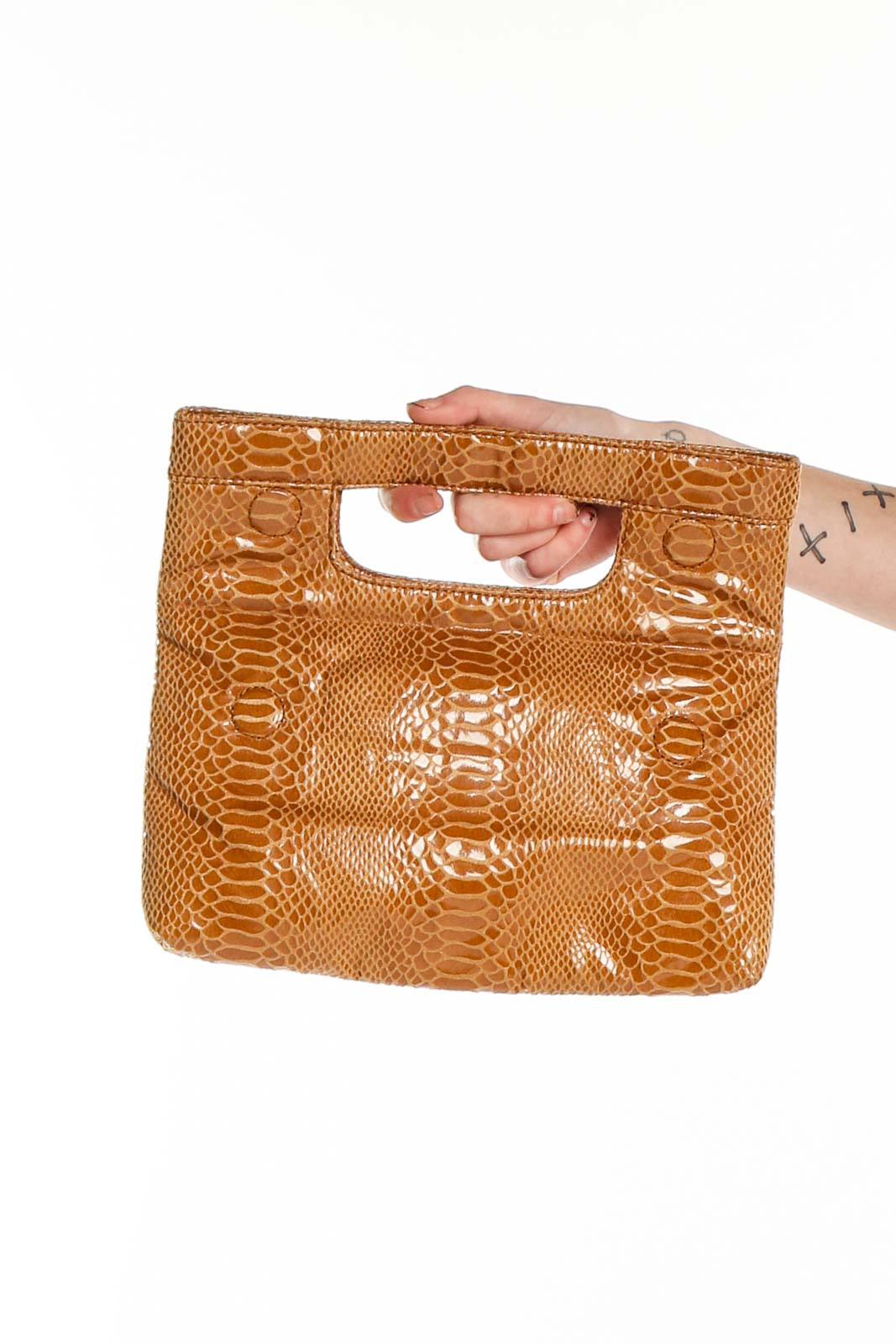 Front view of Joan Rivers tan snakeskin textured clutch bag with cut-out handle