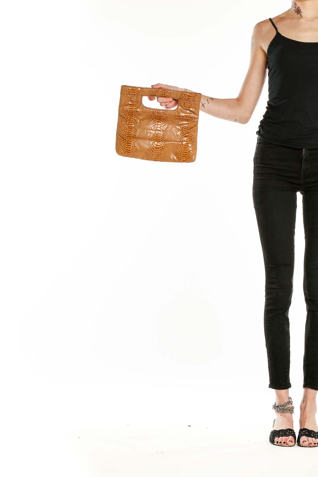 Front view of Joan Rivers tan snakeskin textured clutch bag with cut-out handle