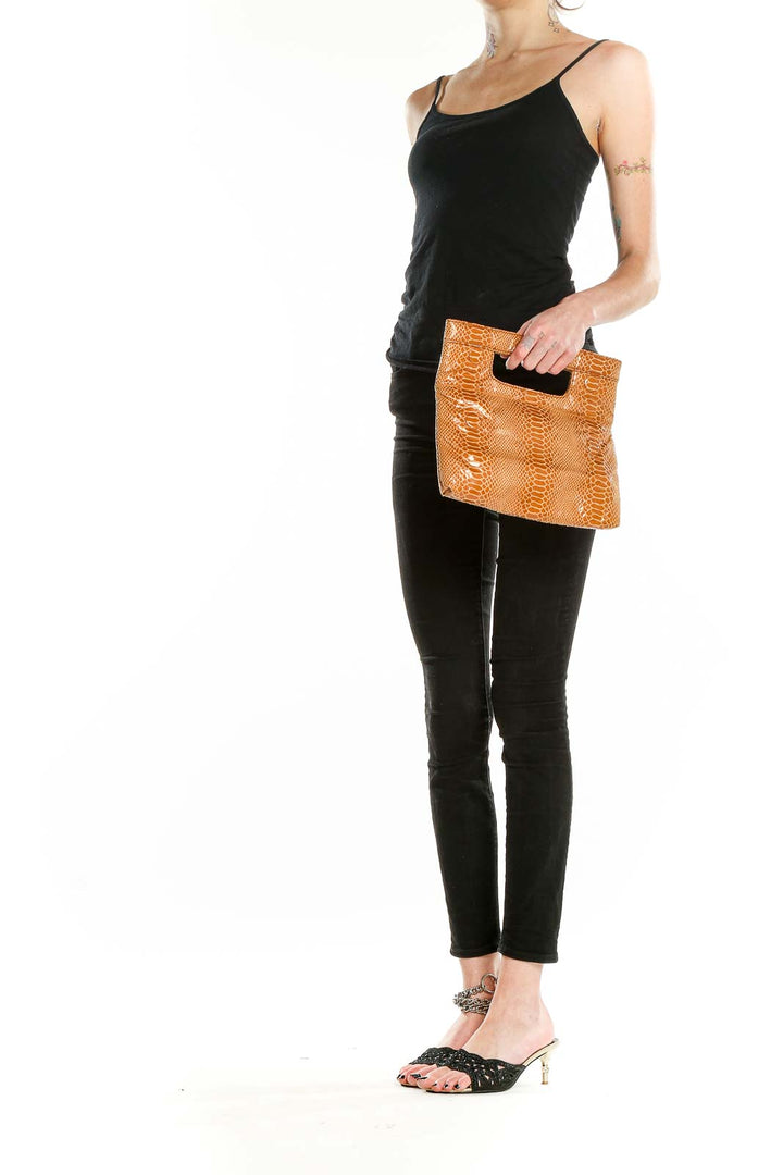 Front view of Joan Rivers tan snakeskin textured clutch bag with cut-out handle