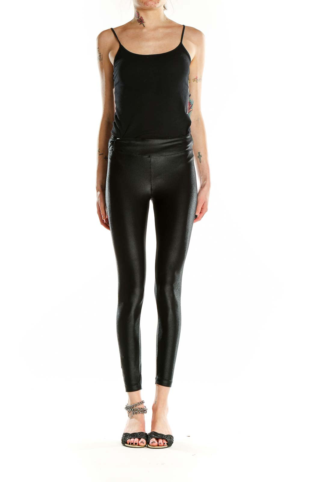 Front view of KORAL black shiny high-waisted leggings on model