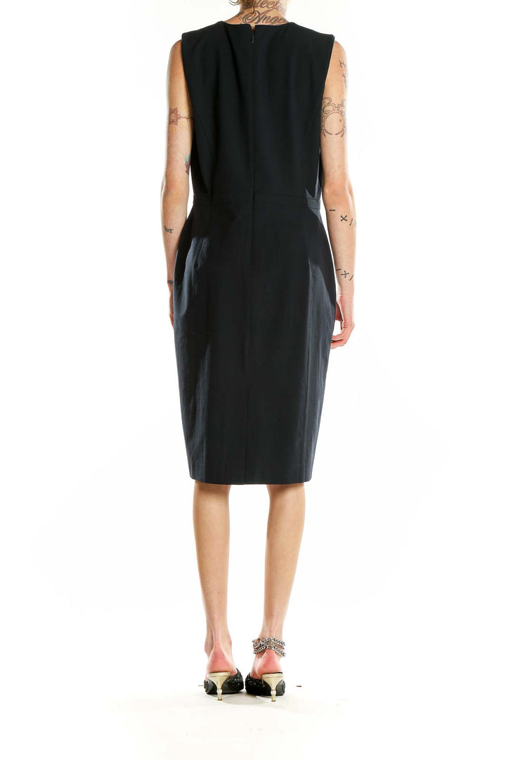 Back view of Ann Taylor black sleeveless sheath dress showing subtle back slit