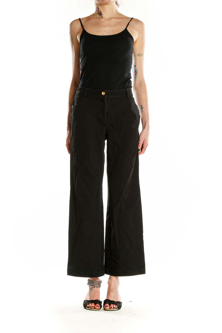 Front view of St. John Caviar black wide-leg trousers on model